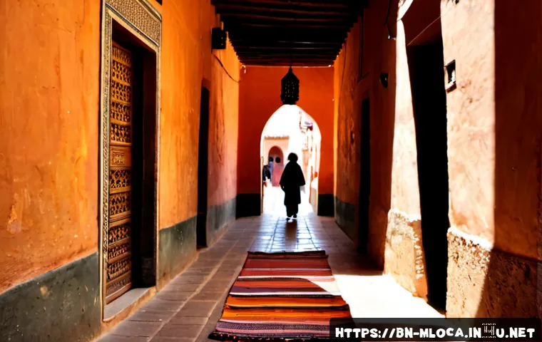 올드가드 영화 속 모로코 명소 - Photorealistic cinematic view of a historic Marrakech medina alley at golden hour, warm terracotta w...